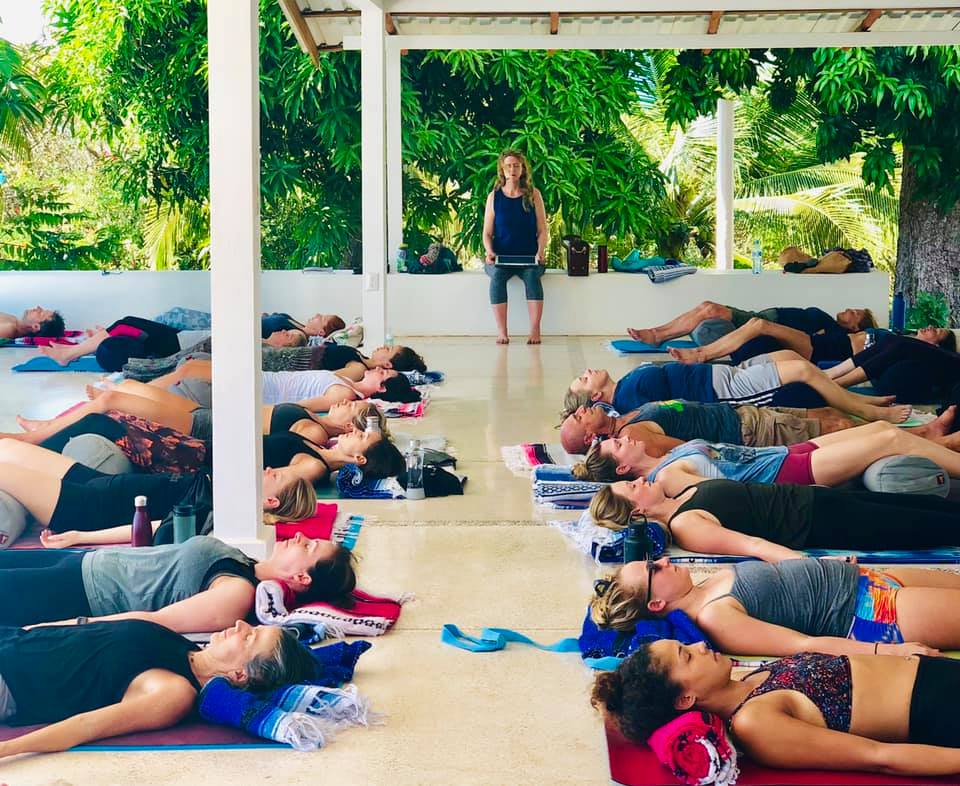 Classroom of Yogis practicing yoga nidra in costa rica