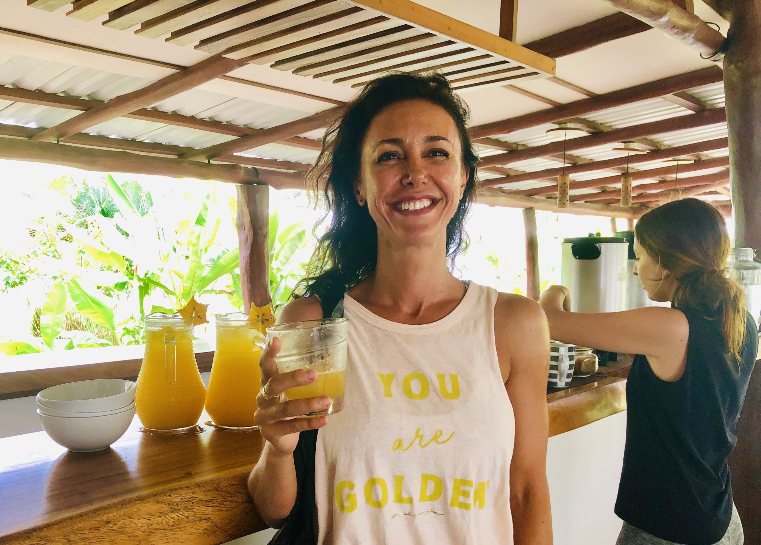 Author Christina Hennelly enjoys a glass of fresh juice in costa rica at our 200 hour YTT