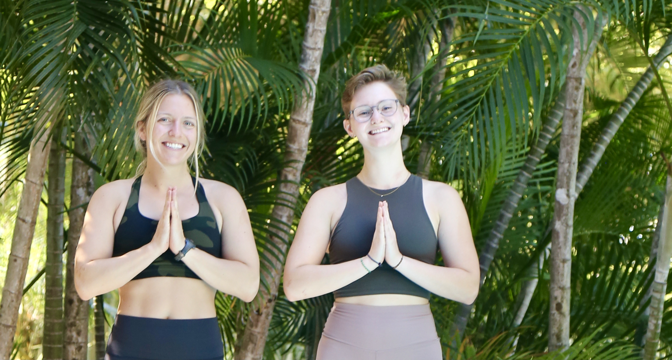 Two yoginis with hands in prayer position
