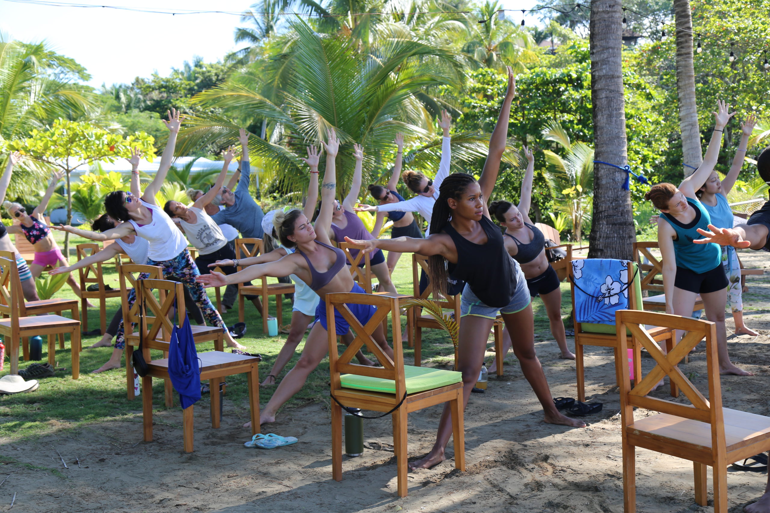 200 Hour Yoga Teacher Trainees doing chair yoga in Costa Rica