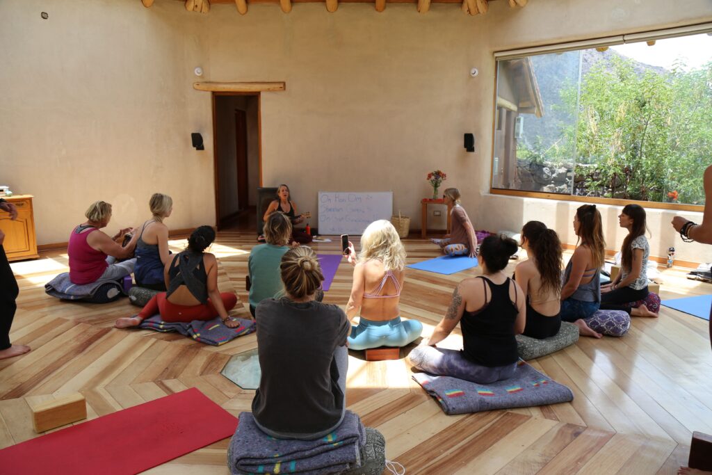 Students in Yoga Teacher Training program in Peru Learning to chant