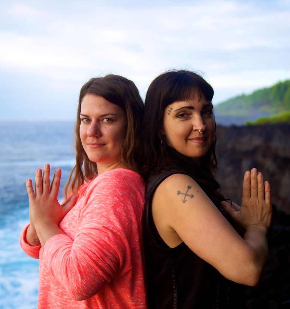 Two Yogis Back to Back practicing Mudra in Yoga Teacher Training Program with Soma Yoga Institute in Hawaii